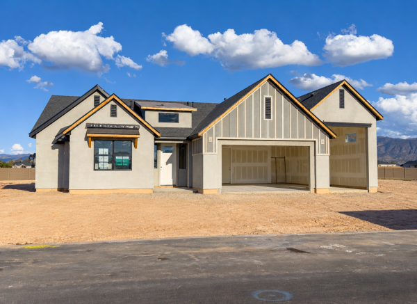 New home under construction with a three-car garage.